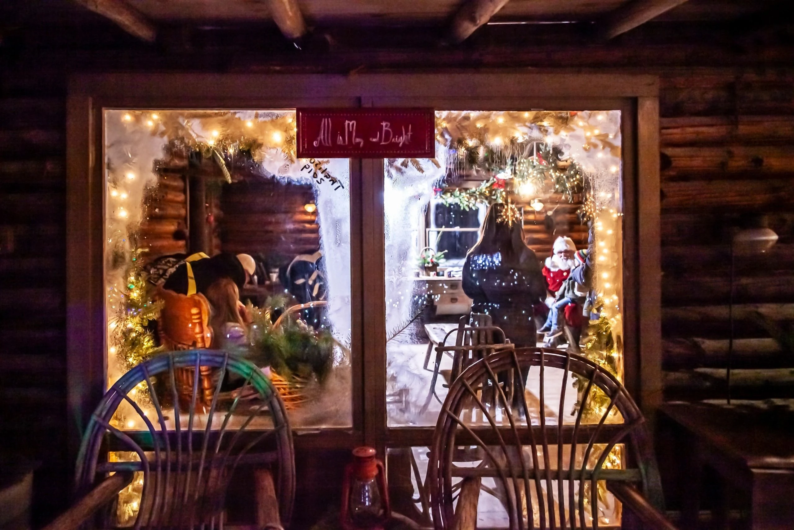 The decorated cabin at Peacock Road Family Farm, with visitors visible through the windows.