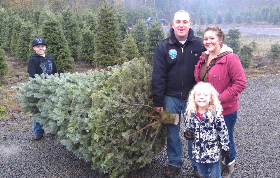 A family with a tree at Olmsted’s farm.